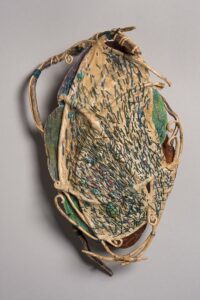 Variations on a Shark’s Purse ocean kelp, wax linen, pattern paper, turquoise stones 13" x 9" x 3" SOLD